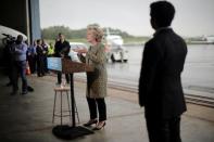 U.S. Democratic presidential candidate Hillary Clinton speaks to the media before boarding her campaign plane at the Westchester County airport in White Plains, New York, U.S. September 19, 2016. REUTERS/Carlos Barria