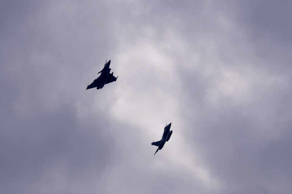 FILE - Two Dassault Rafale fighter jets fly after a signing ceremony between French President Emmanuel Macron and Croatia's Prime Minister Andrej Plenkovic in Zagreb, Croatia, Thursday, Nov. 25, 2021. Serbia is close to signing a deal on the purchase of 12 French Rafale multi-purpose fighter jets, the Serbian President Aleksandar Vucic announced Tuesday, April 9, 2024, in what would mark a shift from its traditional military supplier Russia. (AP Photo/Darko Vojinovic, File)