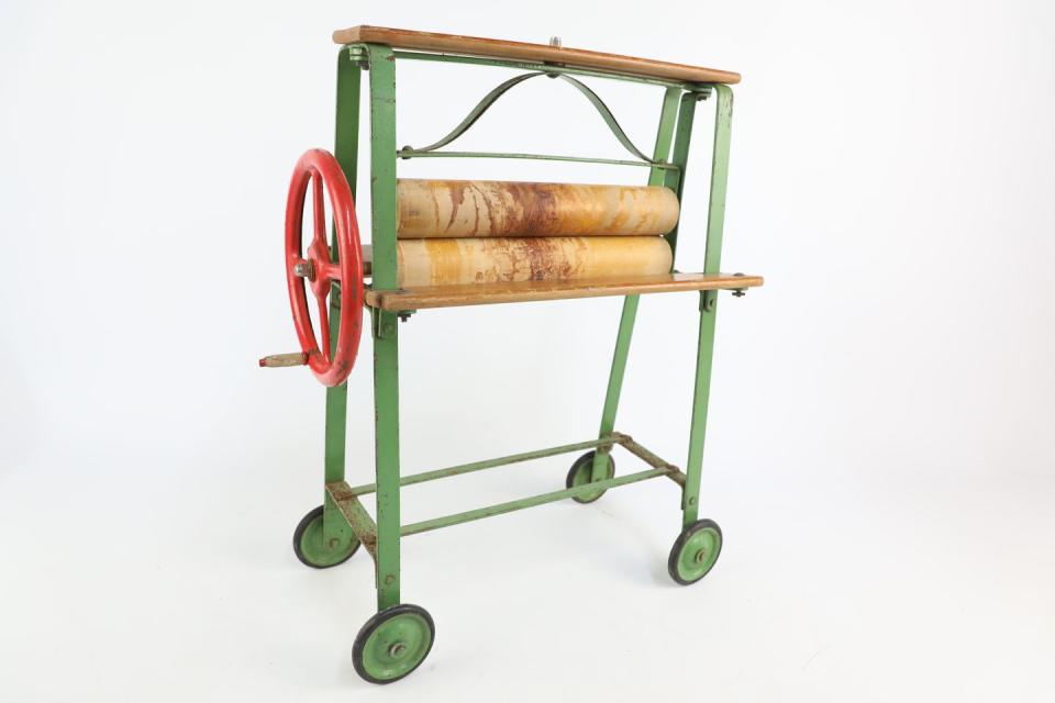 <p>Dating back to the 1930s, this clothes mangle was used by children to teach them how to do the washing. </p>