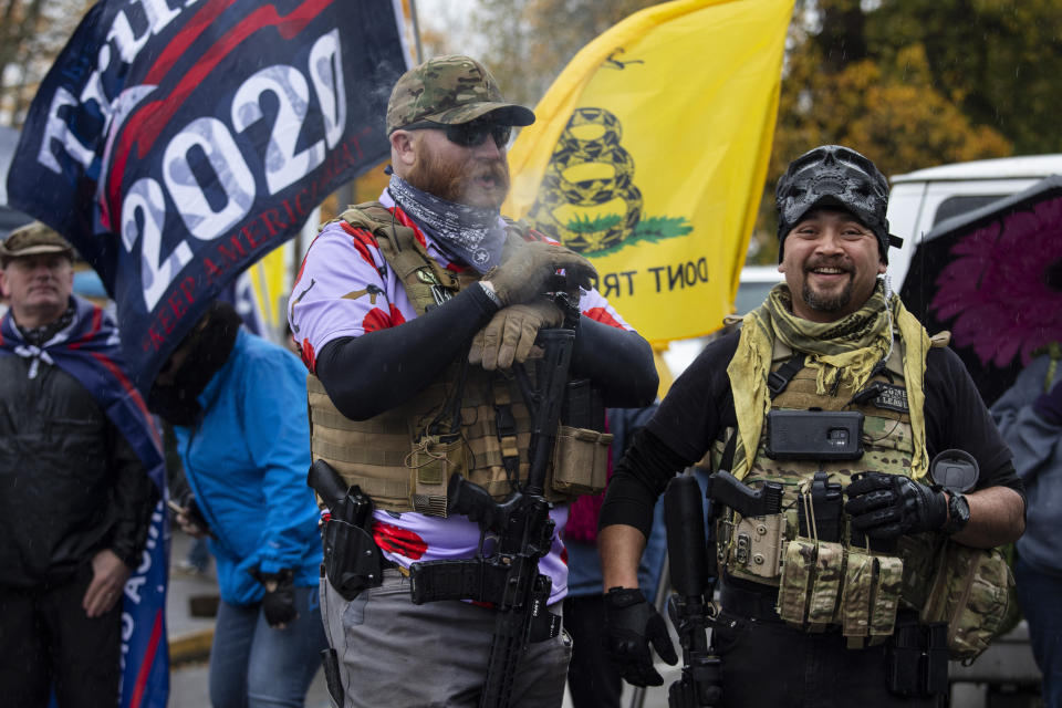 Armed supporters of President Donald Trump attend a ' Stop The Steal ' rally at the Oregon State Capitol protesting the outcome of the election on Saturday, Nov. 14, 2020 in Salem, Ore. (AP Photo/Paula Bronstein)