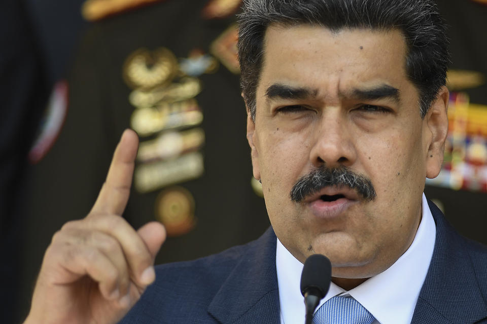 FILE - In this March 12, 2020, file photo, Venezuelan President Nicolas Maduro speaks at a press conference at the Miraflores Presidential Palace in Caracas, Venezuela. The Trump administration will announce Thursday, March 26, 2020, indictments against Maduro and members of his inner circle for effectively converting Venezuela's state into a criminal enterprise at the service of drug traffickers and terrorist groups, according to multiple people familiar with the situation. (AP Photo/Matias Delacroix, File)