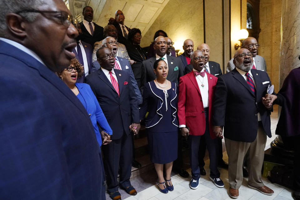 Members of the Mississippi Legislative Black Caucus hold hands and sing "We Shall Overcome" following a news conference where they expressed disappointment at the passage of House Bill 1020, legislation that would create a separate court system in the Capitol Complex Improvement District, Wednesday, Feb. 8, 2023, at the Mississippi Capitol in Jackson. (AP Photo/Rogelio V. Solis)