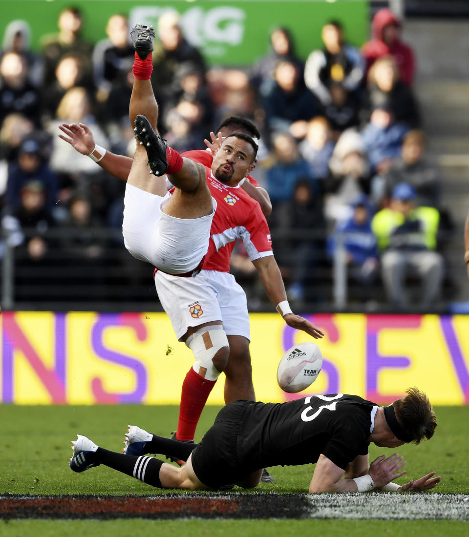 Tonga's James Faiva, top, collides with New Zealand's Jordie Barrett during their rugby test match in Hamilton, New Zealand, Saturday, Sept. 7, 2019. The All Blacks defeated Tonga 92-7. (Andrew Cornaga/Photosport via AP)