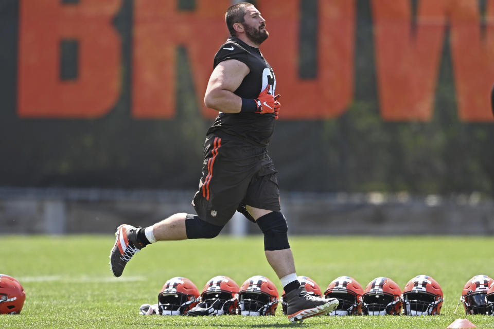 FILE - Cleveland Browns offensive lineman JC Tretter runs during an NFL football practice at the team training facility in Berea, Ohio, in this Tuesday, June 15, 2021, file photo. Tretter is president of the NFLPA. “I know we have learned to work in a very difficult environment, and we will do it again," NFL commissioner Roger Goodell said. "That is one of the things we learned ... hearing clubs and the NFLPA saying our relationship has never been stronger. I interpret that as a trust that has been built here that will take us forward and will be the long-lasting legacy of this season.” (AP Photo/David Dermer, File)