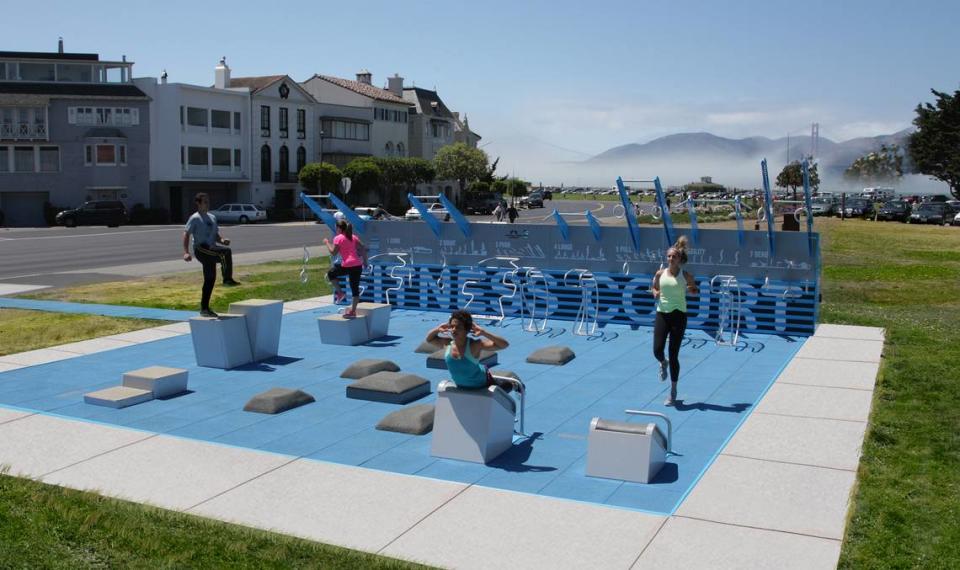 People demonstrate exercises on the first Fitness Court, designed by the National Fitness Campaign and built in San Francisco, California. There are now about 500 of the outdoor gyms across the United States.