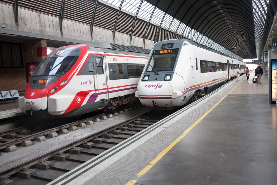 Trains at platform inside Maria Zambrano railway station Malaga, Spain.