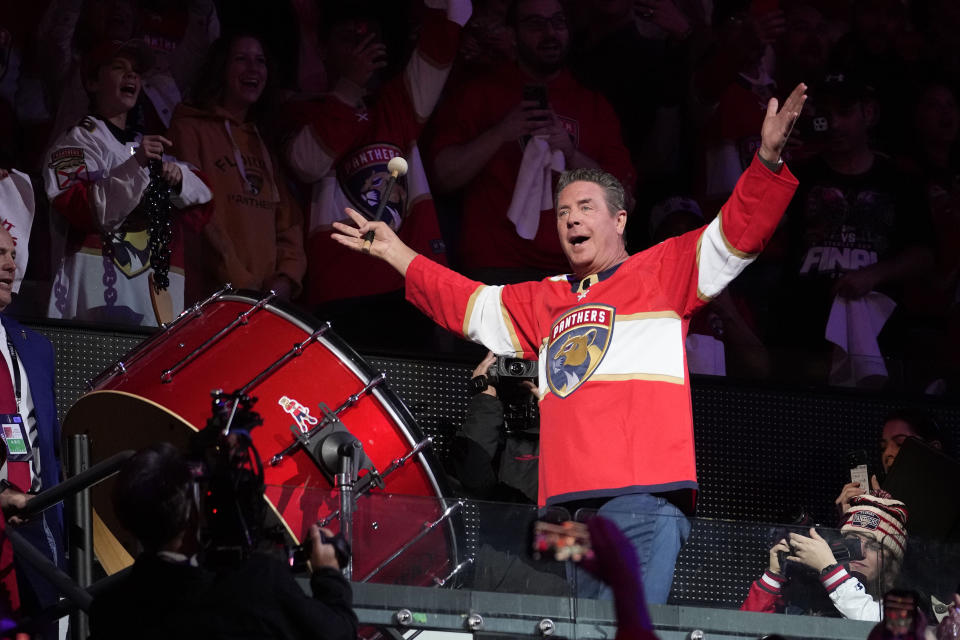 Former Miami Dolphins quarterback Dan Marino gets the crowd to cheer before Game 3 of the NHL hockey Stanley Cup Finals between the Florida Panthers and the Vegas Golden Knights Thursday, June 8, 2023, in Sunrise, Fla. (AP Photo/Lynne Sladky)