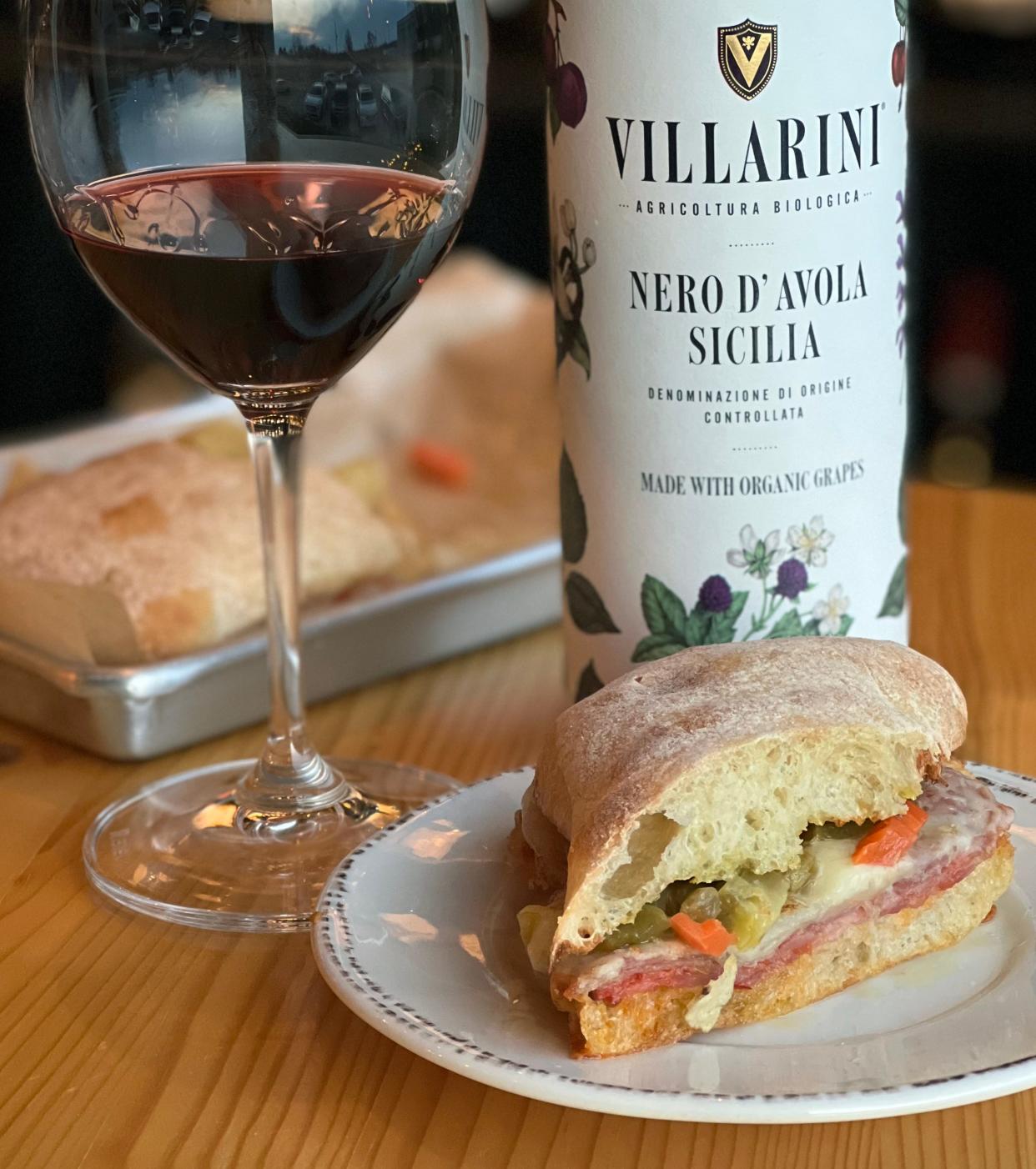 A North Hill panino and a glass of Villarini Nero d'Avola Sicilia from Cellar 59 Wine Bar & Wine Shop in Akron.