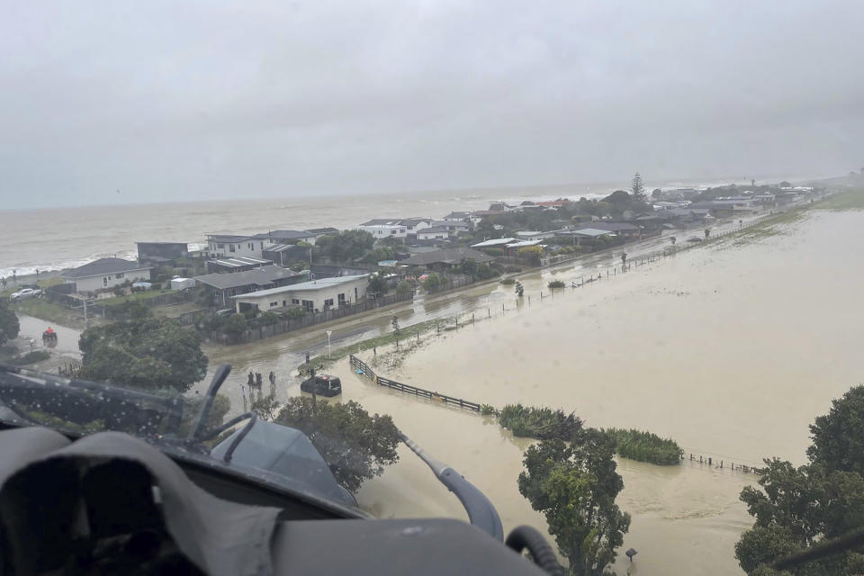 In this image released by the New Zealand Defense Force on Wednesday, Feb. 15, 2023, homes in the Esk Valley, near Napier, New Zealand, are flooded. Source: New Zealand Defense Force via AP