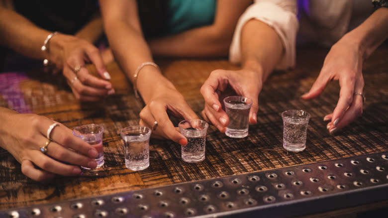 women choosing alcohol shots