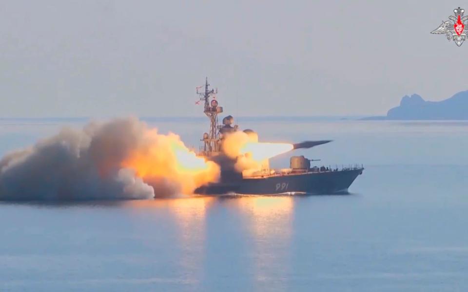 In this photo made from video provided by the Russian Defense Ministry Press Service, a Russian navy boat launches an anti-ship missile test in the Peter The Great Gulf in the Sea of Japan. - Russian Defence Ministry Press Service