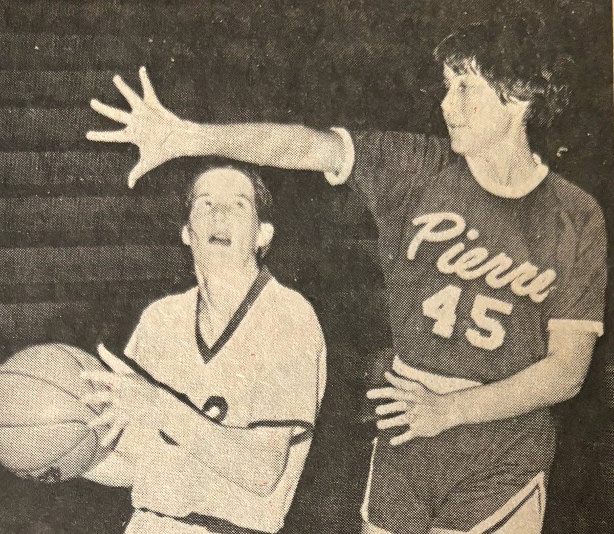 Watertown's Kay Stormo drives against Pierre's Karen McDonald during a 1977 high school girls basketball game in the Civic Arena. Stormo won the Eastern South Dakota Conference girls cross country title in record time in the afternoon and returned home to/ tally 25 points and 13 rebounds in a 65-47 girls basketball win over Pierre.