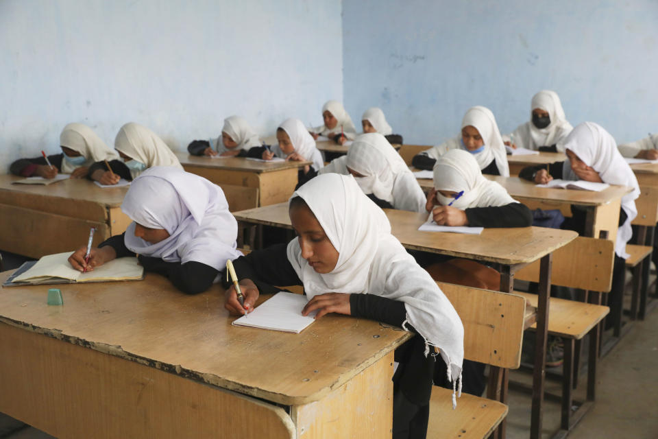 Image: Students attend classes in a primary school in Kabul. (Rahmat Gul / AP)