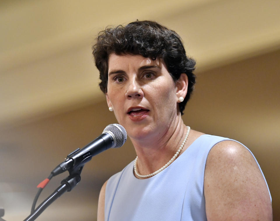 FILE - In this Aug. 18, 2018, file photo, Amy McGrath, a Kentucky Democratic candidate for Congress, speaks to supporters during the 26th annual Wendell Ford Dinner in Louisville, Ky. Democrat Amy McGrath has raised more money than Republican U.S. Rep. Andy Barr in Kentucky’s 6th Congressional district. McGrath has raised more than $6 million while Barr has raised more than $4 million. (AP Photo/Timothy D. Easley, File)