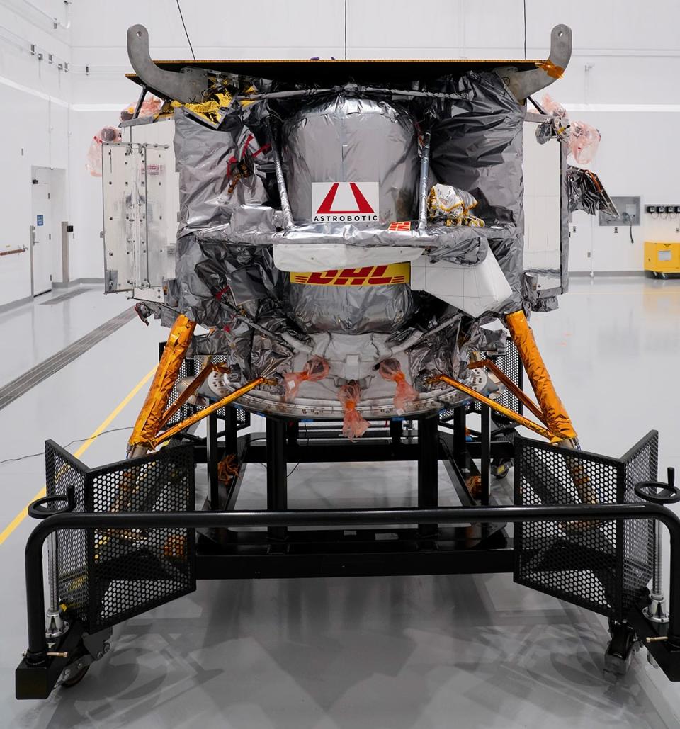 A picture shows Peregrine lander on a trolley before launch, in a clean room