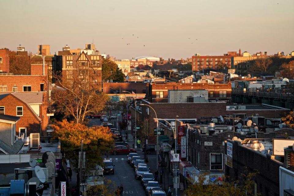 Sunset over Jackson Heights buildings.