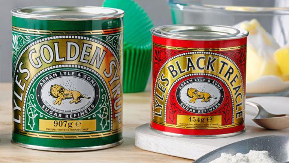  Lyle's Golden Syrup and Lyles Black Treacle tins showing the lion logo. 