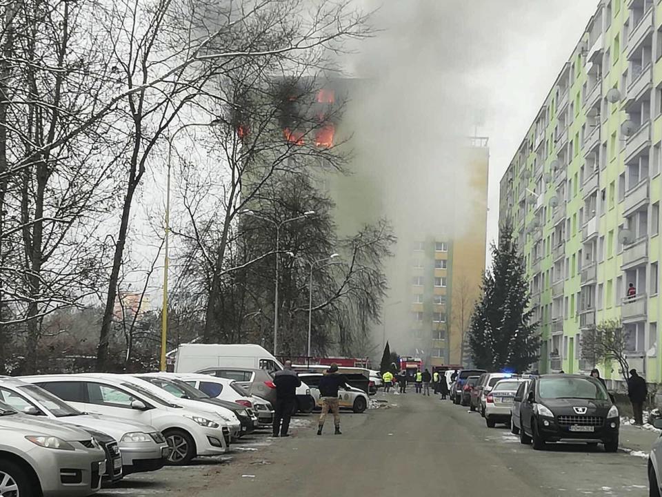 A fire burns as a gas explosion severely damaged a 12th storey apartment building in Presov, Slovakia, Friday, Dec. 6, 2019. The firefighters said the explosion occurred between the ninth and 12th storey and witnesses told them several people have escaped to the roof. Authorities didn't immediately confirm any injuries or fatalities. (AP Photo/Police of Slovakia/HO)