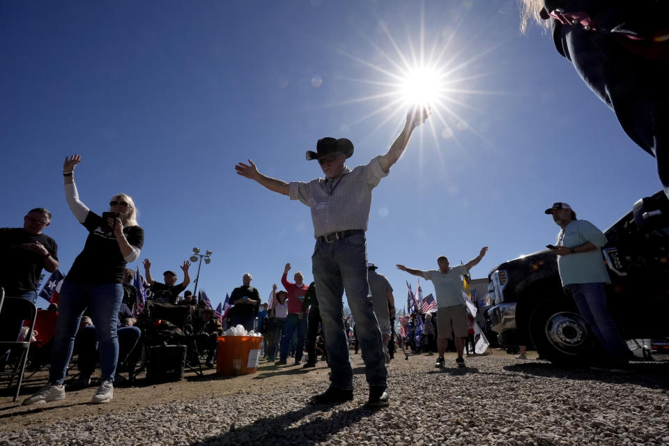 Participants listen to Praise and Worship music during a "Take Our Border Back" convoy and rally, Saturday, Feb. 3, 2024, in Quemado, Texas. (AP Photo/Eric Gay)