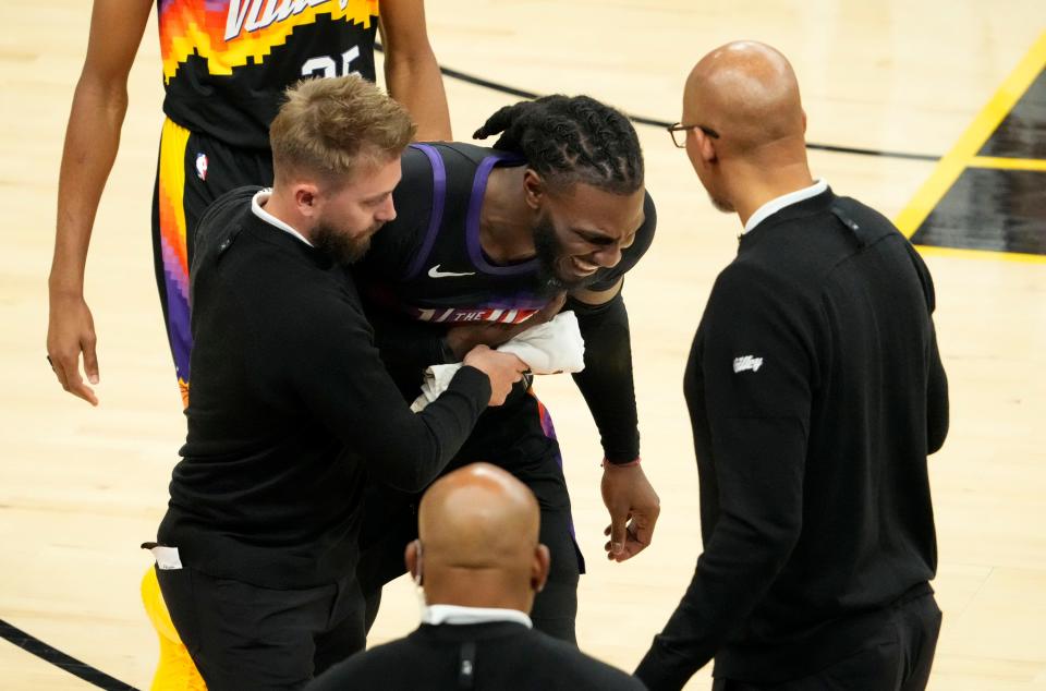 May 10, 2022; Phoenix, Arizona, USA; Phoenix Suns forward Jae Crowder (99) suffers an injury after colliding with Dallas Mavericks guard Josh Green during game five of the second round for the 2022 NBA playoffs at Footprint Center.