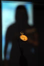 A visitor to the SeaCity Museum looks at a pocket watch that belonged to Titanic steward Sidney Sedunary that is displayed at the museum's Titanic exhibition on April 3, 2012 in Southampton, England. The new SeaCity Museum, which will open at 1.30pm on April 10, 100 years to the day since the Titanic set sail from the city. The museum, which cost 15 GBP million, promises to tell the largely untold story of Southampton's Titanic crew and the impact the tragedy had on the city, as well as featuring other aspects of the city's seafaring past. (Photo by Matt Cardy/Getty Images)