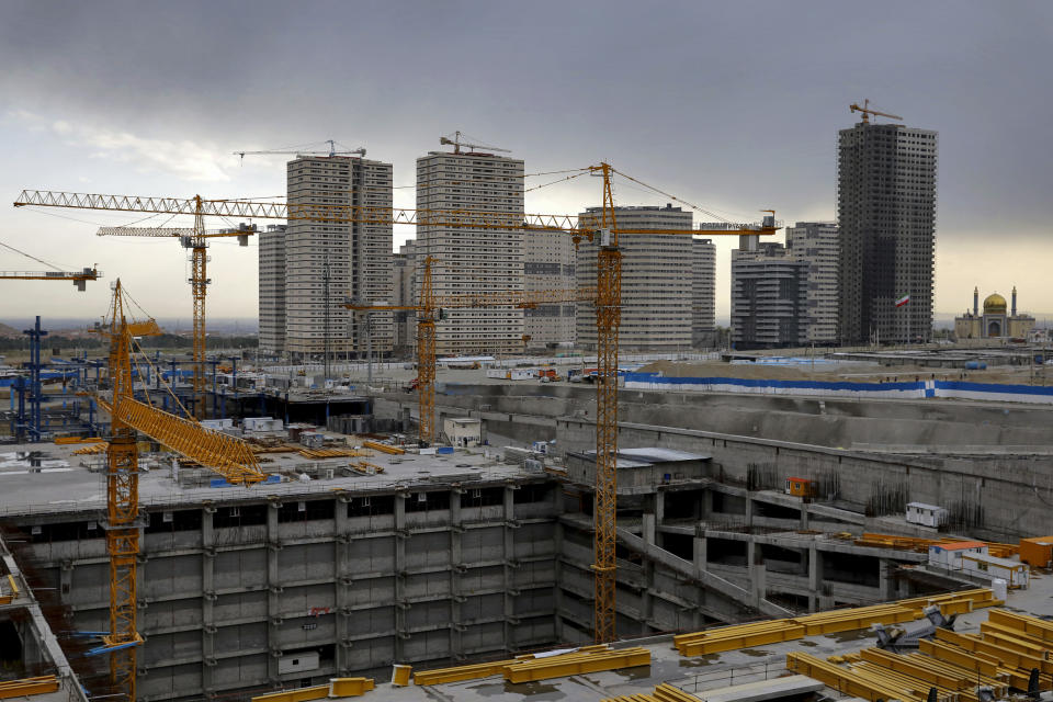 In this March 21, 2020 photo, work has halted on semi-finished construction projects due the the coronavirus outbreak, in Tehran, Iran. The typically frenetic streets of Iran’s capital, Tehran, have fallen silent and empty due to the virus outbreak that’s gripped the Islamic Republic. (AP Photo/Ebrahim Noroozi)