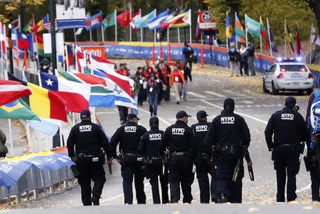 New York Police Department counter-terrorism officers patrol the course near the finish line area in Central Park before the start of the New York City Marathon in New York, November 3, 2013. REUTERS/Mike Segar