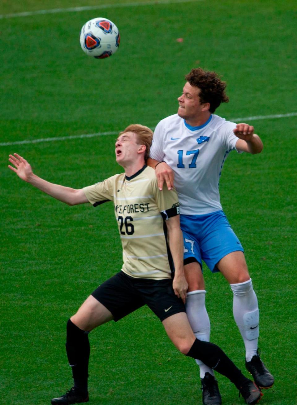 Wake Forest’s Colin Thomas (26) and UNC-Chapel Hill’s Cameron Fisher (17) battle for the ball during the Division I Men’s Soccer Championship quarterfinals at WakeMed Soccer Park in Cary Monday, May 10, 2021.