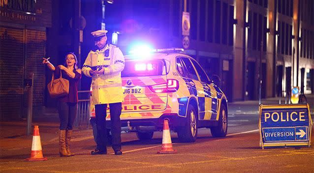 A woman speaks to police in Manchester. Photo: Getty Images