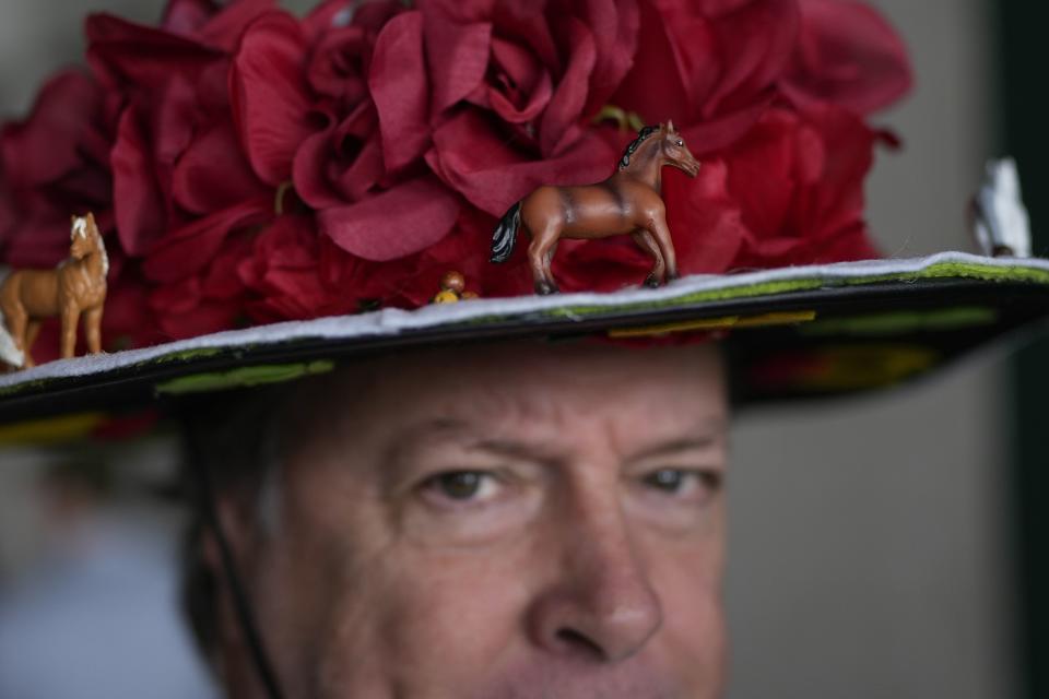 A man walks to his seat on the day of the 149th running of the Kentucky Derby at Churchill Downs Saturday, May 6, 2023, in Louisville, Ky. | Bryan Woolston, Associated Press