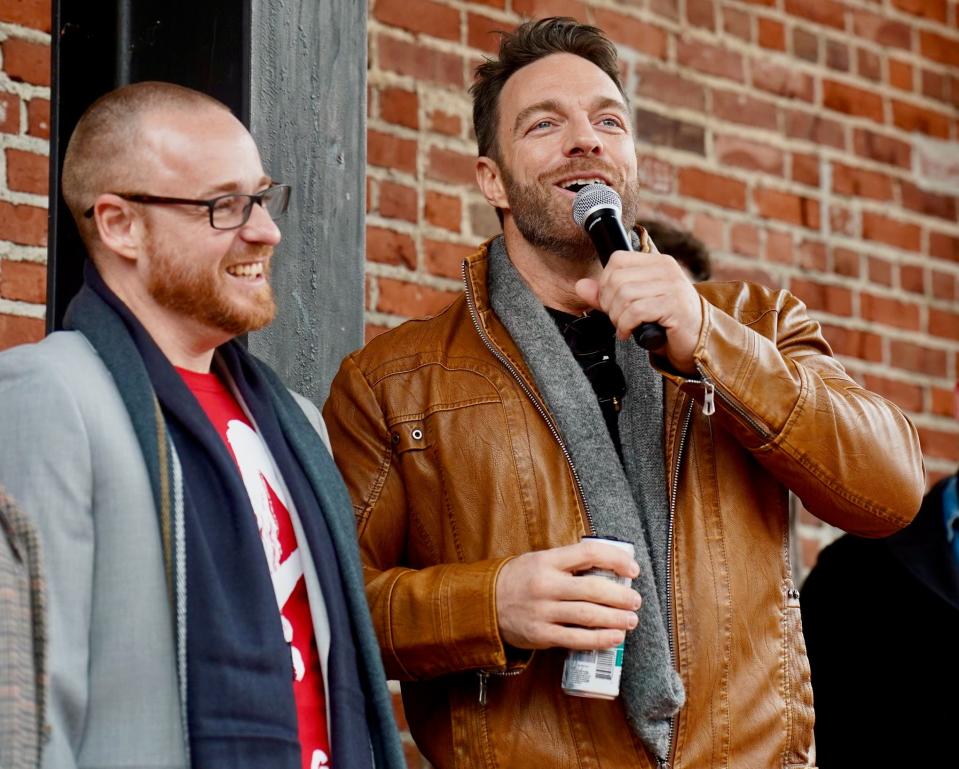 WWE star Shaun Ricker, aka LA Knight, 41, (right) shares a story Saturday about asking the guy at the Taco Bell drive-thru window, then schoolmate and now Hagerstown Councilman Matthew Schindler (left), for a lot of "fire sauce" and Schindler coming through with a to-go bag full.