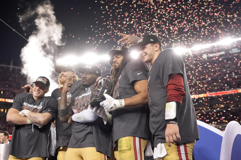 San Francisco 49ers running back Christian McCaffrey, from left, celebrates with tight end George Kittle, wide receiver Deebo Samuel, linebacker Fred Warner and quarterback Brock Purdy after the NFC Championship NFL football game against the Detroit Lions in Santa Clara, Calif., Sunday, Jan. 28, 2024. (AP Photo/Mark J. Terrill)