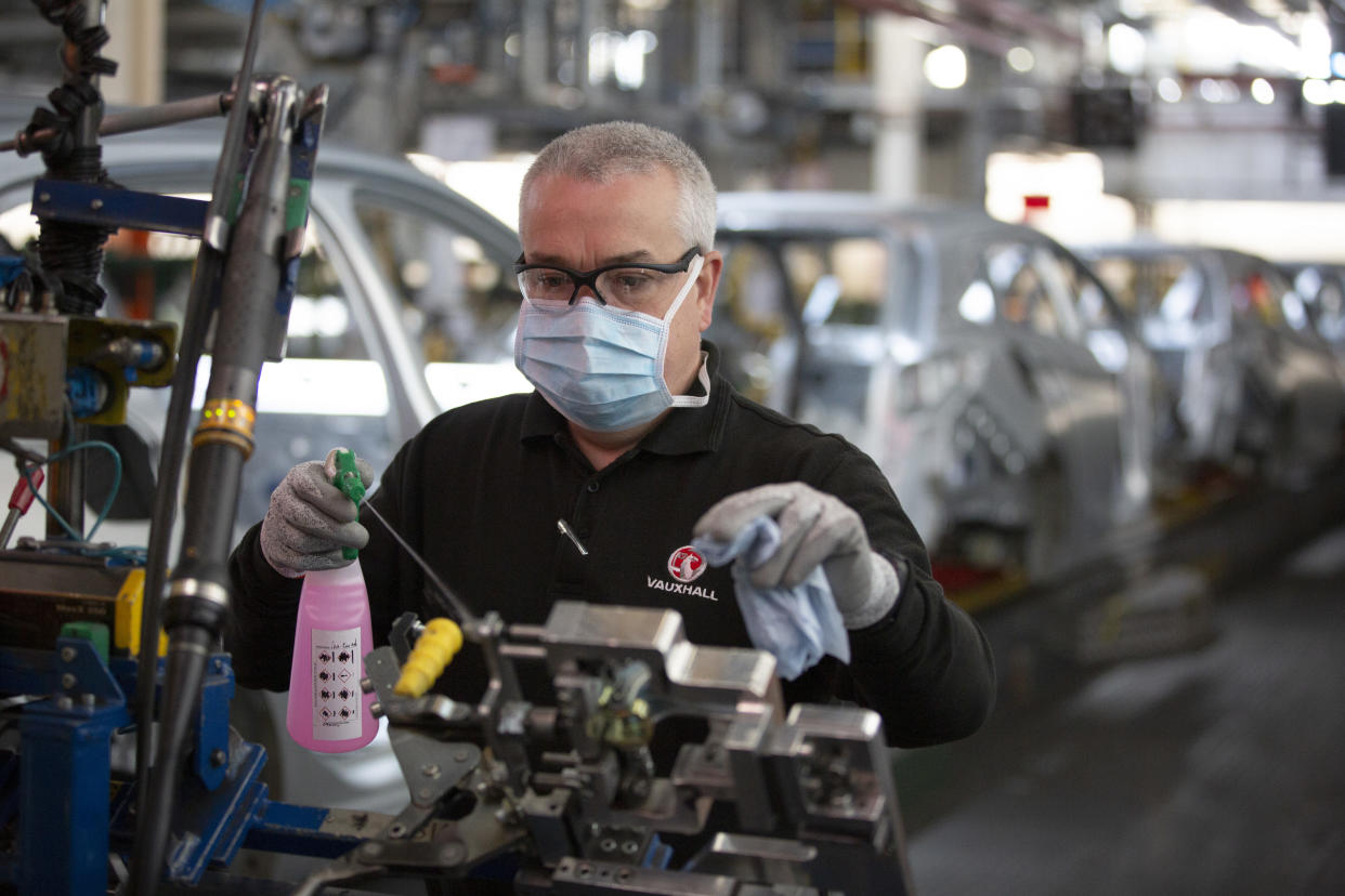 A member of staff at the Vauxhall car factory cleaning and disinfecting a work station during preparedness tests and redesign ahead of re-opening following the COVID-19 outbreak. Located in Ellesmere Port, Wirral, the factory opened in 1962 and currently employs around 1100 workers. It ceased production on 17 March 2020 and will only resume work upon the advice of the UK Government, which will involve stringent physical distancing measures being in place across the site. (Photo by Colin McPherson/Corbis via Getty Images)