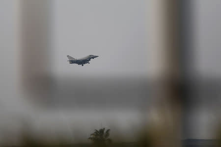 A fighter jet prepares to land at RAF Akrotiri, a military base Britain maintains on Cyprus, April 14, 2018. REUTERS/Yiannis Kourtoglou