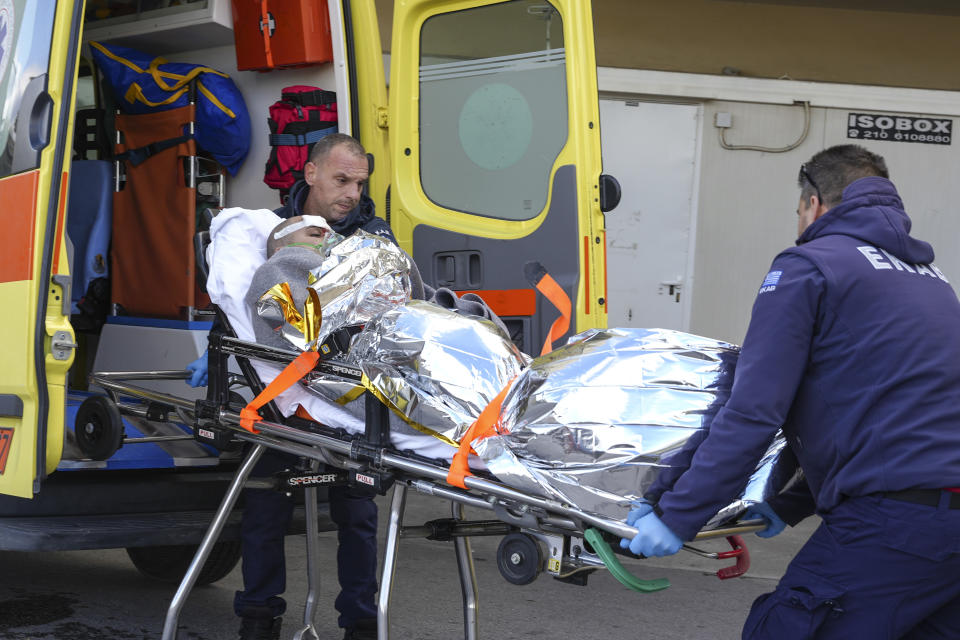 Paramedics transfer a survivor of a shipwreck at a hospital, on the northeastern Aegean Sea island of Lesbos, Greece, Sunday, Nov. 26, 2023. A cargo ship sank off the Greek island of Lesbos early Sunday, leaving 13 crew members missing and one rescued, authorities said. The Raptor, registered in the Comoros, was on its way to Istanbul from Alexandria, Egypt, carrying 6,000 tons of salt, the coast guard said. It had a crew of 14, including eight Egyptians, four Indians and two Syrians, the coast guard said.(AP Photo/Panagiotis Balaskas)