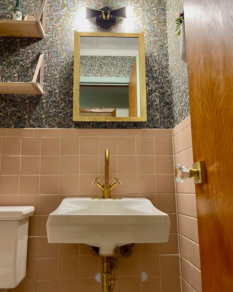 Brass faucet in newly renovated bathroom.