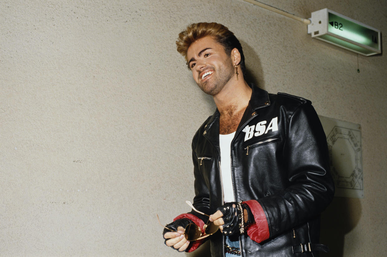 English singer and songwriter George Michael (1963-2016) pictured wearing a leather jacket with BSA logo backstage during the Japanese/Australasian leg of his Faith World Tour, February-March 1988. (Photo by Michael Putland/Getty Images)