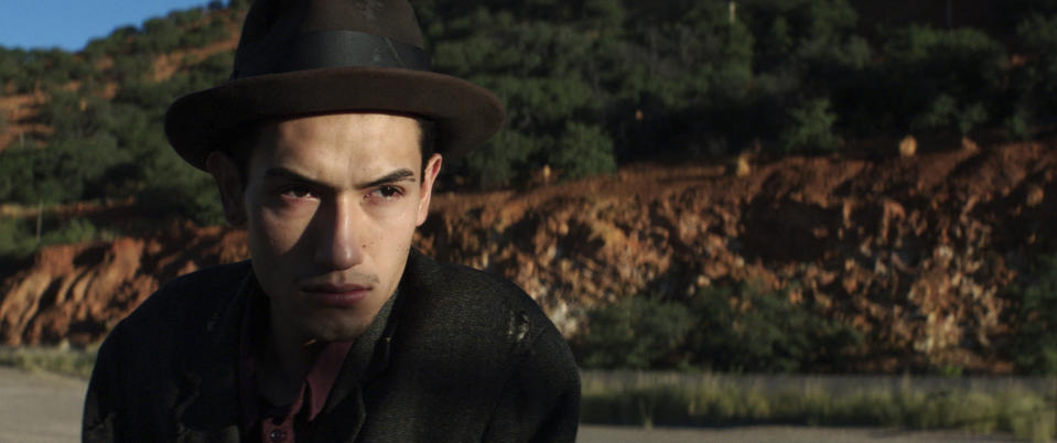 This undated photo provided by 4th Row Films shows Fernando Serrano, 23, who plays a striking miner in "Bisbee '17," a story of how some 1,200 miners, most of them immigrants, were pulled violently from their homes in Bisbee, Ariz., by a private police force and put on cattle cars for deportation to a desolate area of New Mexico in 1917. The dark history of Bisbee was largely an open secret for decades in the funky old copper town just seven miles north of the U.S.-Mexico border. It's the sixth film of director Robert Greene, who said he learned about the town southeastern Arizona around 15 years ago. (Jarred Alterman/4th Row Films via AP)