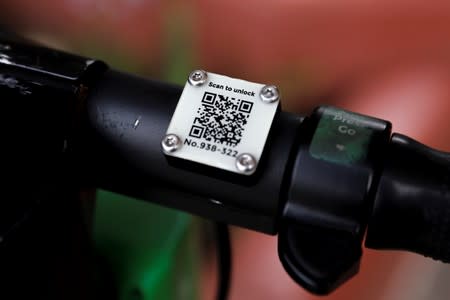 A scooter scanner code is shown on a handlebar of the two-wheeled vehicle before being impounded by Scoot Scoop for being left on private property in San Diego, California