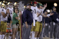 Notre Dame coach Brian Kelly, center, stands on the sideline during the first half of the team's NCAA college football game against Stanford in Stanford, Calif., Saturday, Nov. 27, 2021. (AP Photo/Jed Jacobsohn)