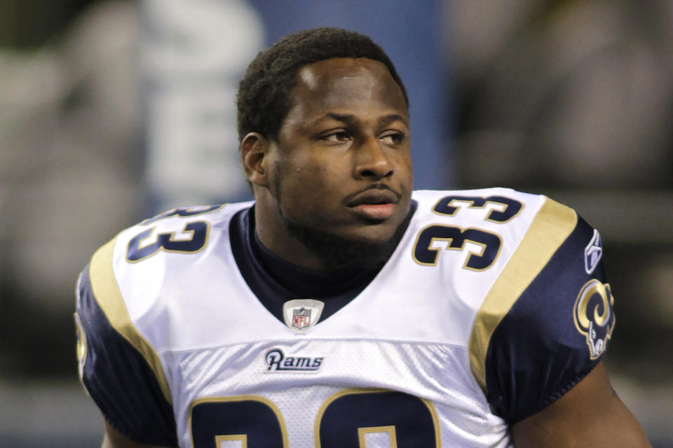 FILE - St. Louis Rams Carnell "Cadillac" Williams is shown during warm ups before the first half of an NFL football game against the Seattle Seahawks, Monday, Dec. 12, 2011, in Seattle. Carnell Williams was an All-American running back on Auburn's undefeated team in 2004. Now, the former NFL rookie of the year is running the show. Williams is serving as Auburn's interim coach for the last four games, starting Saturday at Mississippi State. He replaces Bryan Harsin, who was fired Monday, Oct. 31, 2022, after going 9-12 with the Tigers. (AP Photo/Ted S. Warren, File)