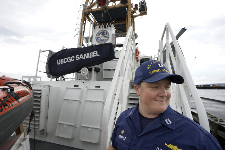 U.S. Coast Guard Lt. Kelli Normoyle, Commanding Officer of the Coast Guard Cutter Sanibel, descends stairs aboard the vessel, Thursday, Sept. 16, 2021, at a shipyard in North Kingstown, R.I. Normoyle was one of two cadets who formally started the process to create the CGA Spectrum Diversity Council just a few months after the law known as "don't ask, don't tell" was repealed on Sept. 20, 2011. (AP Photo/Steven Senne)