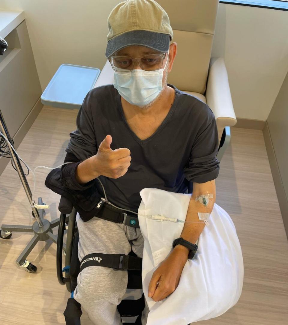 James Michael Tyler in a wheelchair after chemo