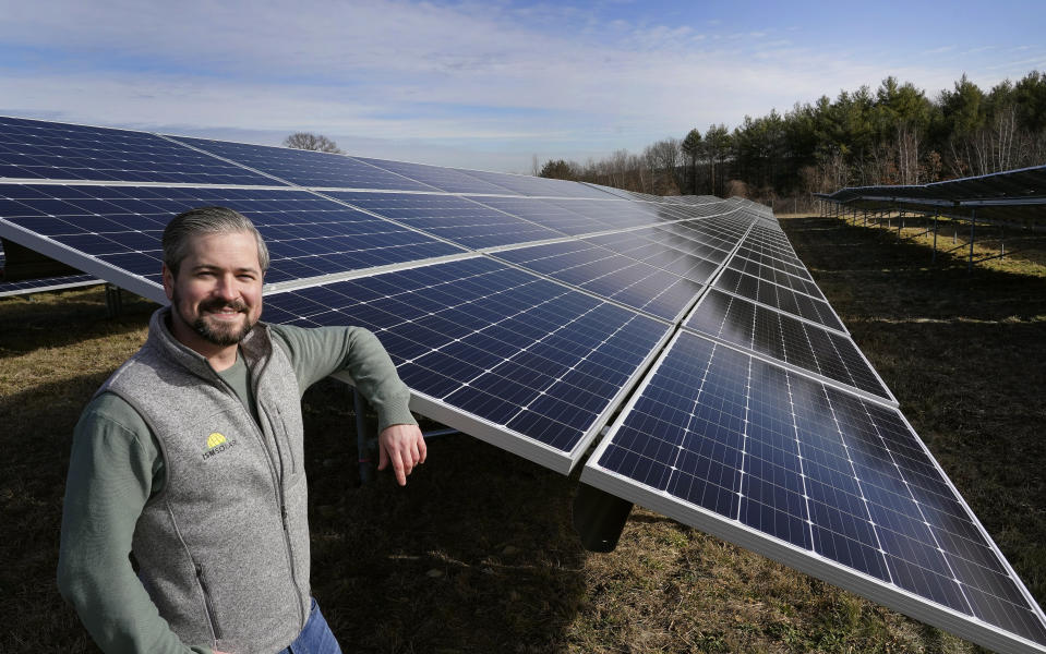 Mike Lucini, vice president of ISM Solar, poses, Tuesday Jan. 26, 2021, in Burrillville, R.I., at ISM's 10-acre solar farm which is the first of its kind in the state. U.S. President Joe Biden wants to change the way the U.S. uses energy by expanding renewables, but faces several challenges. (AP Photo/Elise Amendola)