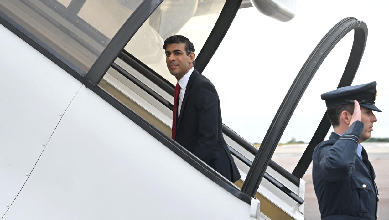 Britain's Prime Minister Rishi Sunak (L) boards on July 11, 2023 in London his plane departing to Vilnius, Lithuania, where he is to attend a NATO Summit. (Photo by Paul ELLIS / POOL / AFP) (Photo by PAUL ELLIS/POOL/AFP via Getty Images)