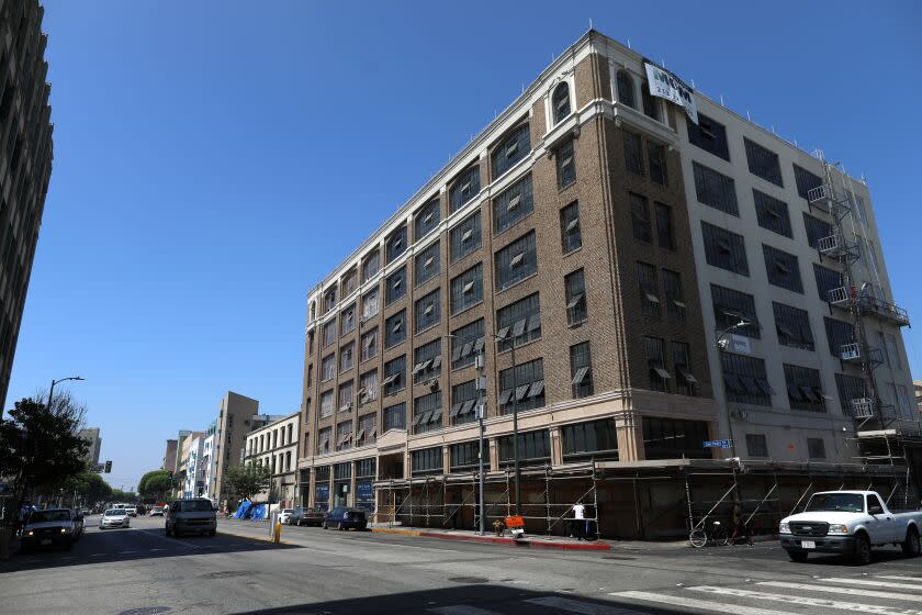 LOS ANGELES, CALIF. -- TUESDAY, JULY 16, 2019: The Historic Catalina building has been repurposed for restaurants, distribution, retail, industrial and creative office space located at 443 South San Pedro Street in Los Angeles, Calif., on July 16, 2019. Community leaders and homeless advocates held a press conference in response to the Los Angeles Department of City Planning's rezoning of Skid Row, at LA Can. This marks the launch of a campaign to prevent the displacement of homeless people, which is being led by the Skid Row Now and 2040 Coalition – a coalition of community organizations, neighborhood activists, and social services providers. (Gary Coronado / Los Angeles Times)