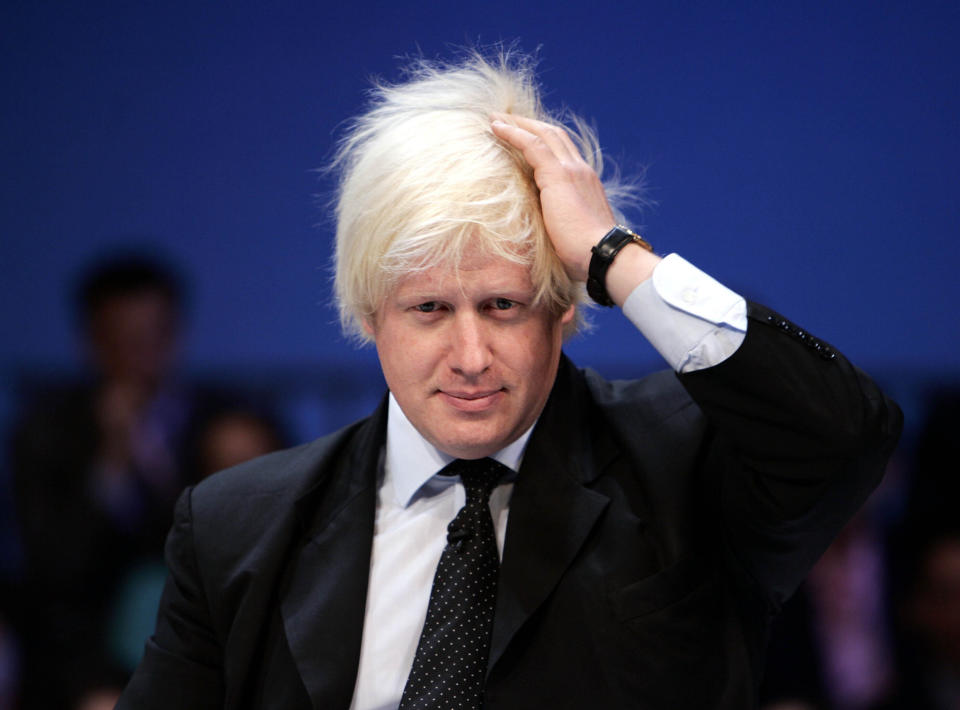 FILE - Boris Johnson, Britain's Conservative party spokesman for Higher Education, reacts as he listens to a delegate's question during a debate at the party's conference in Bournemouth, south England, Wednesday Oct. 4, 2006. British media say Prime Minister Boris Johnson has agreed to resign on Thursday, July 7 2022, ending an unprecedented political crisis over his future. (AP Photo/Lefteris Pitarakis, file)