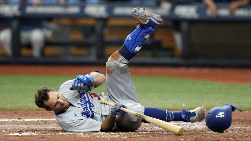 Los Angeles Dodgers' Chris Taylor goes down after an inside pitch from Tampa Bay Rays' Jason Adam during the eighth inning of a baseball game Sunday, May 28, 2023, in St. Petersburg, Fla. (AP Photo/Chris O'Meara)