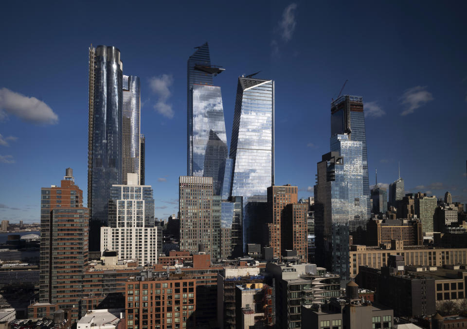 In this Dec. 4, 2018 photo, skyscrapers rise above Hudson Yards in the west side of Manhattan borough of New York. New York City Mayor Bill de Blasio presides over a city that's known for its skyscrapers but he is no fan of the glass towers that have transformed the Manhattan skyline in recent decades. (AP Photo/Mark Lennihan)