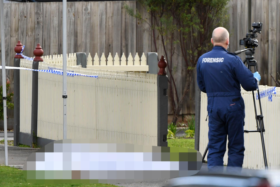 Pictured is a forensic investigator where the body was discovered on the Kilsyth street.